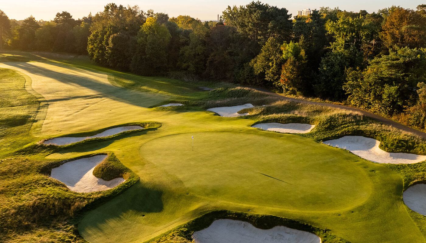 golf green with sand traps around it